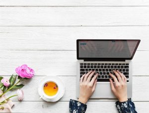 Woman's hands working on laptop.